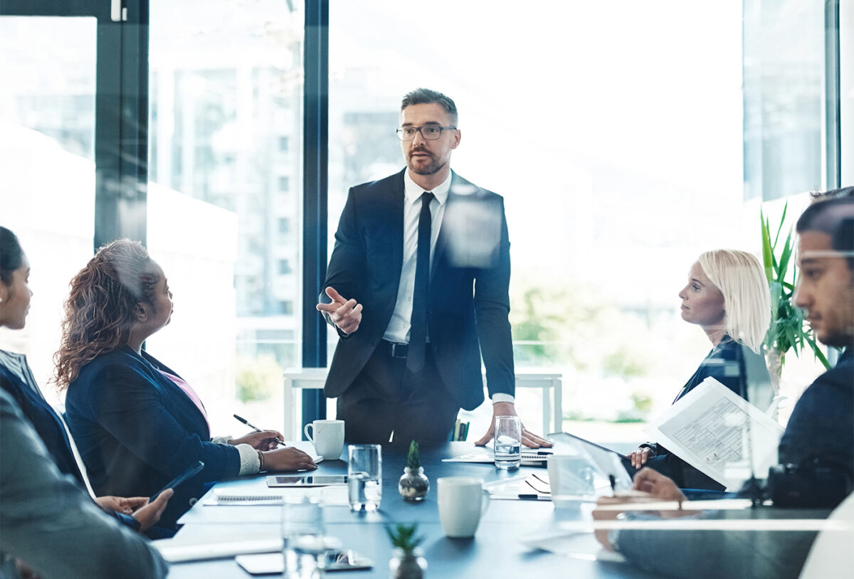 I Actually Have A Solution For That. Cropped Shot Of A Handsome Mature Businessman Giving A Presentation In The Boardroom.